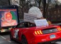 New York display: oversized Modi puppet in convertible with provocative banner 10 New York display: oversized Modi puppet in convertible with provocative banner