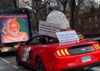 New York display: oversized Modi puppet in convertible with provocative banner 3 New York display: oversized Modi puppet in convertible with provocative banner