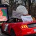 New York display: oversized Modi puppet in convertible with provocative banner 6 New York display: oversized Modi puppet in convertible with provocative banner