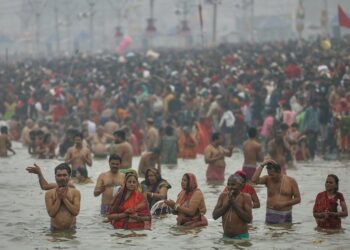 Reverence for the sacred waters of the Ganga and belief in its power to wash away sins bring millions to India’s Maha Kumbh festival 1 Reverence for the sacred waters of the Ganga and belief in its power to wash away sins bring millions to India’s Maha Kumbh festival