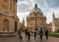 Rhodes Scholarship 2027: Applications Open for Indian Students at Oxford 11 Postgraduate students walking through University of Oxford campus, Rhodes Scholarship 2027 India