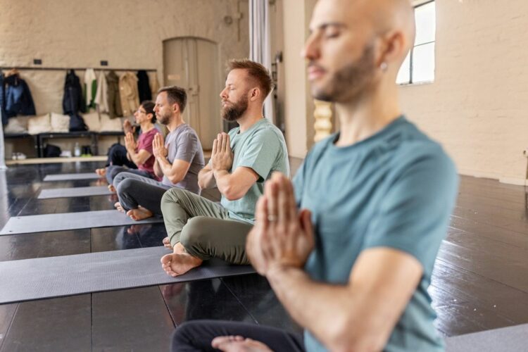 Many yoga classes end with the instructor explaining ‘namaste’ as ‘the divine in me bows to the divine in you.’ Luis Alvarez/DigitalVision via Getty Images
