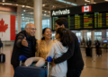 Canada cuts Super Visa wait for Indians to 50 days. Study permits remain the stubborn exception. 10 Indian family at a Canadian airport arrivals hall, Canada super visa processing time Indians 2026