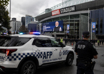 Australian Federal Police vehicle outside Marvel Stadium, Melbourne Meets Modi visit security AFP warning 2026