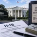New H-1B Fee Rule Clears Critical White House Review, Signals More Costs 7 Indian professional reviewing H-1B visa fee documents on laptop, H-1B fee rule White House review 2026