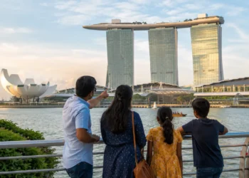 Singapore Welcomes Massive 600,000 Indian Visitors in First Half 2026 3 Indian tourists at Marina Bay Sands Singapore skyline, Singapore Indian visitors first half 2026