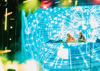 Brampton’s Punjabi Live Music Scene Thrives Beyond the Headline Acts 3 A DJ duo performing under coloured blue, green and red stage lighting at a live venue, representing the Brampton Punjabi live music scene