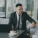 Indian Business Network Melbourne: A Critical Lifeline After Six Lonely Years 6 Two professionals in a mentoring-style conversation at a small table, illustrating an Indian business network Melbourne founders can turn to for support
