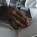 Indian Doctor US Licensing: A Grim 6-Year Path to a Record-Low Match Rate 6 A doctor's hand on medical exam notes with a stethoscope, representing the ECFMG path an Indian doctor follows toward US licensure