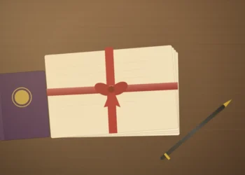 Inherited Property In India: Major 2025 Tax Change Now Critical For UK NRIs 3 A bundle of aged cream documents tied with a red ribbon beside a closed passport-style booklet and a pen on a wooden desk, representing inherited property India NRI paperwork