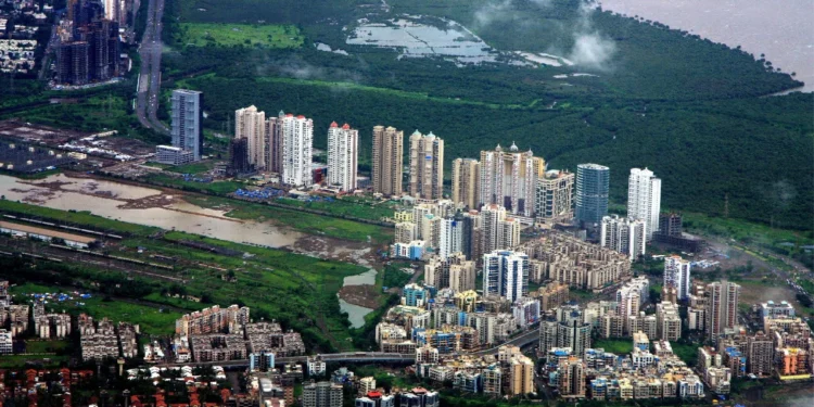 NRI Property Rules India 2026: Alarming Form 128 TDS Shift 1 NRI property rules India 2026 - Navi Mumbai residential skyline