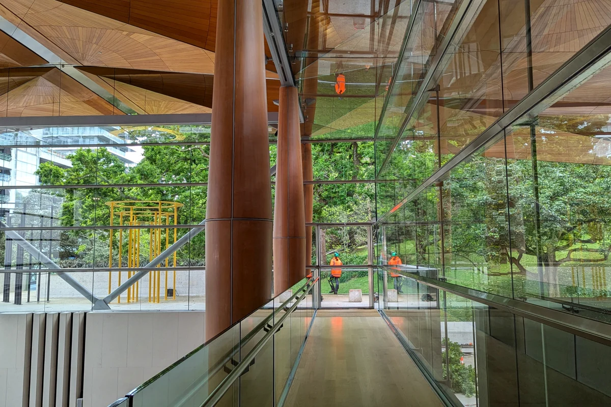 Glass walls, timber ceiling and stairs inside Auckland Art Gallery