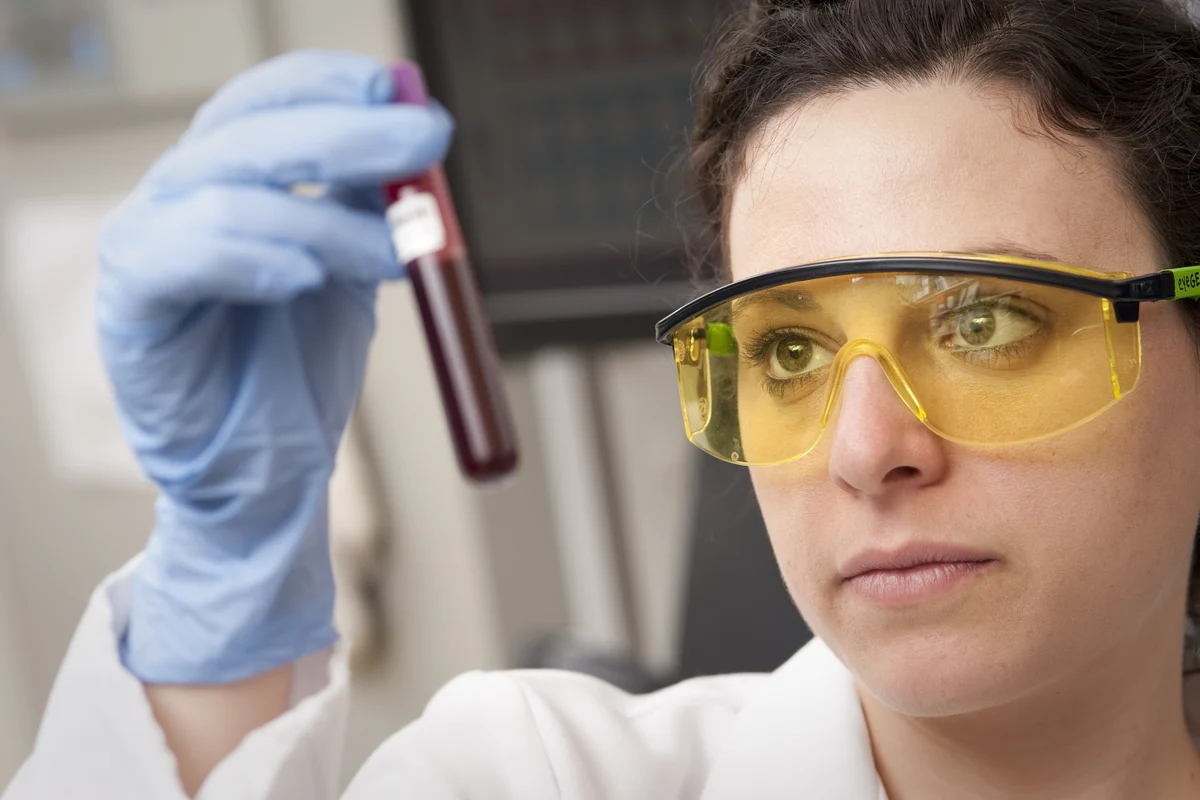 Scientist checking a blood sample in a laboratory