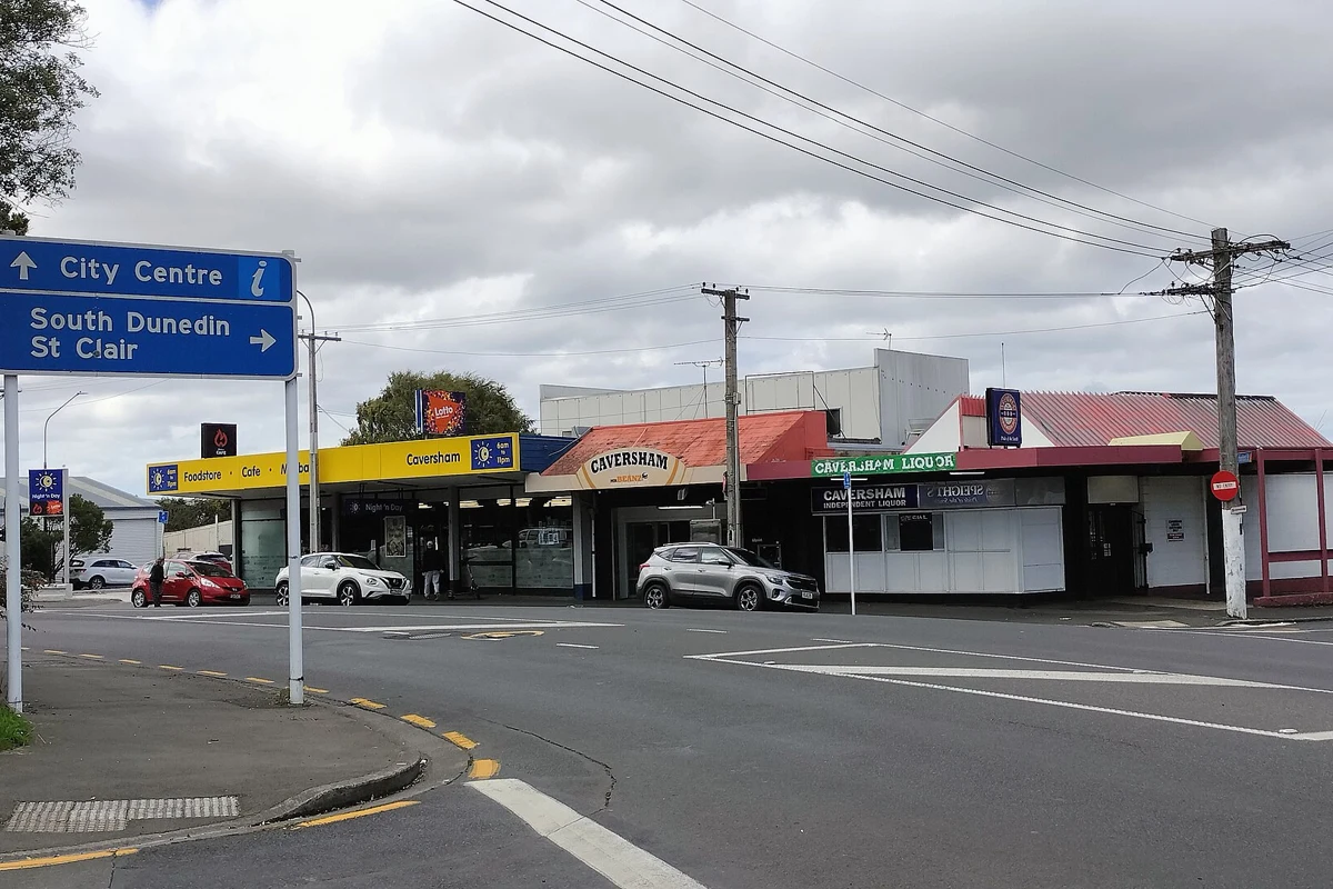 Directional signage on South Road in Caversham, Dunedin, photographed in March 2026.