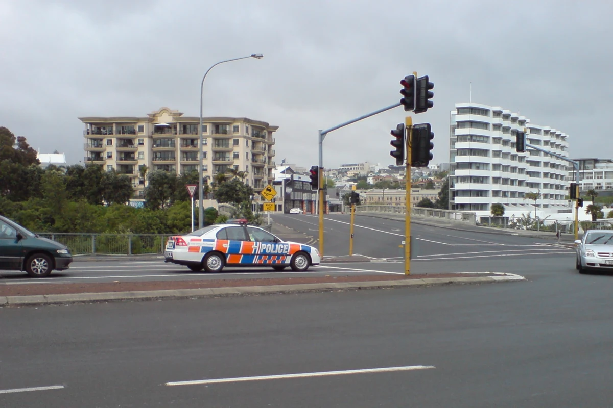 Police car at an intersection in Auckland.