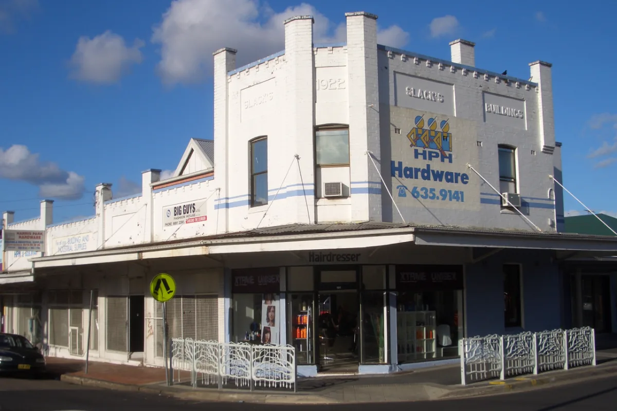 Shopfronts and trading signage at Slack's Buildings on Station Street, Harris Park, Sydney