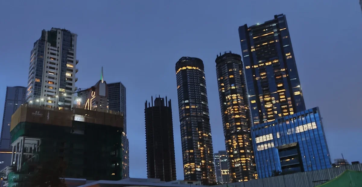 Residential towers in Mumbai at dusk, illustrating the homes covered by NRI property TDS rules