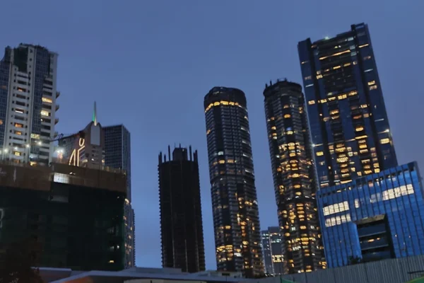 Residential towers in Mumbai at dusk, illustrating the homes covered by NRI property TDS rules