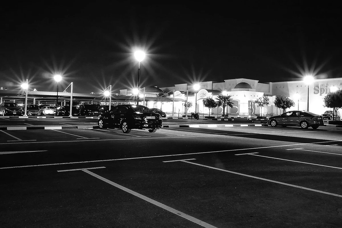 Supermarket and parking area in Dubai’s Silicon Oasis at night