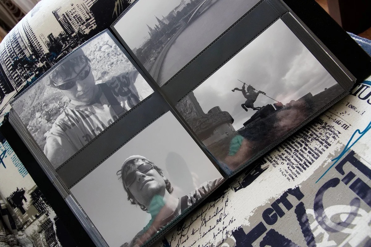 Open photograph album with black-and-white family pictures