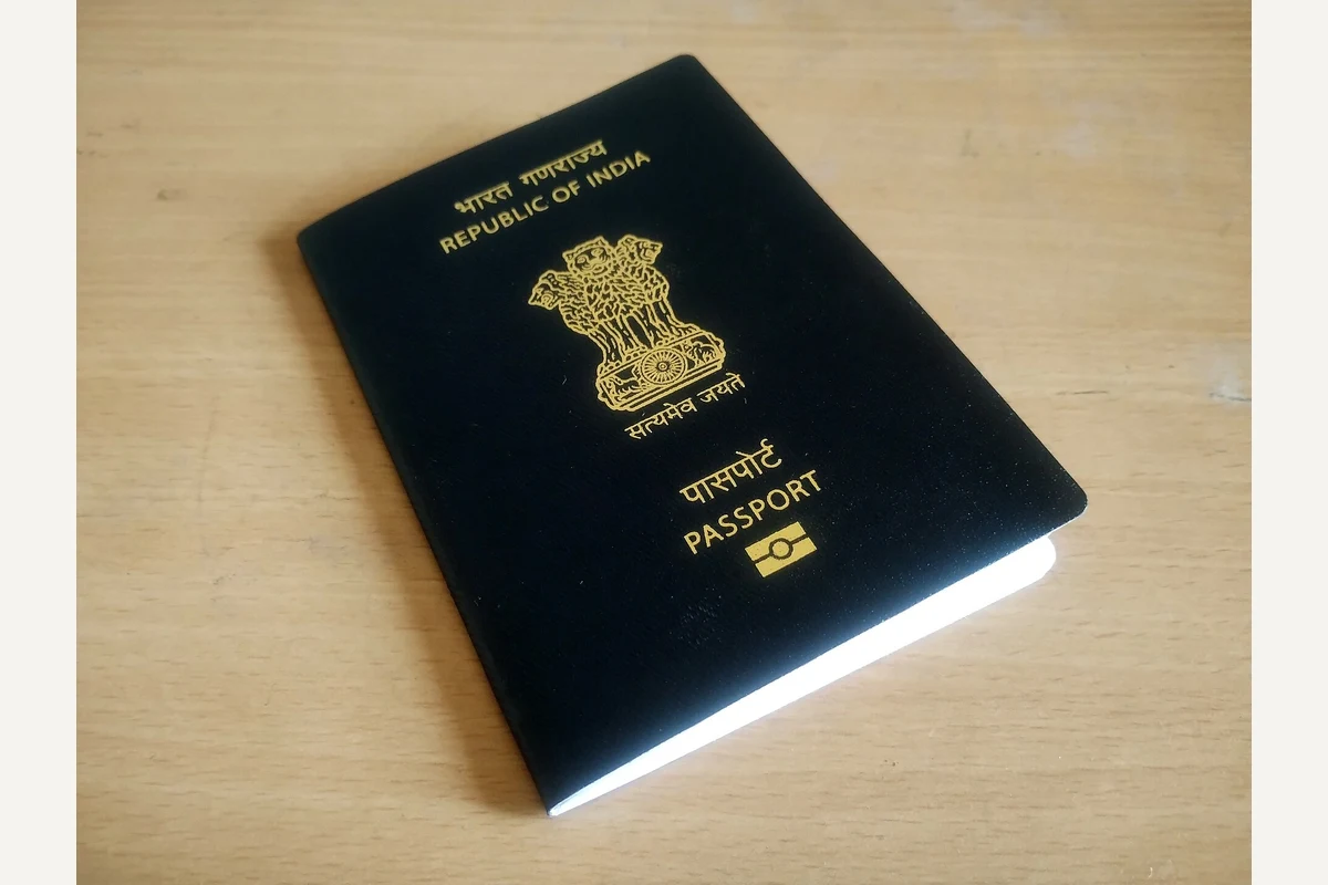 Indian biometric passport with blue cover and gold national emblem