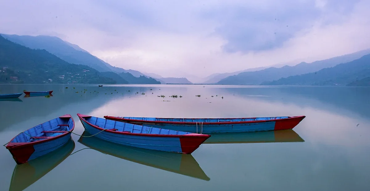 Boats on Phewa Lake in Pokhara, illustrating Indian travel trends 2027