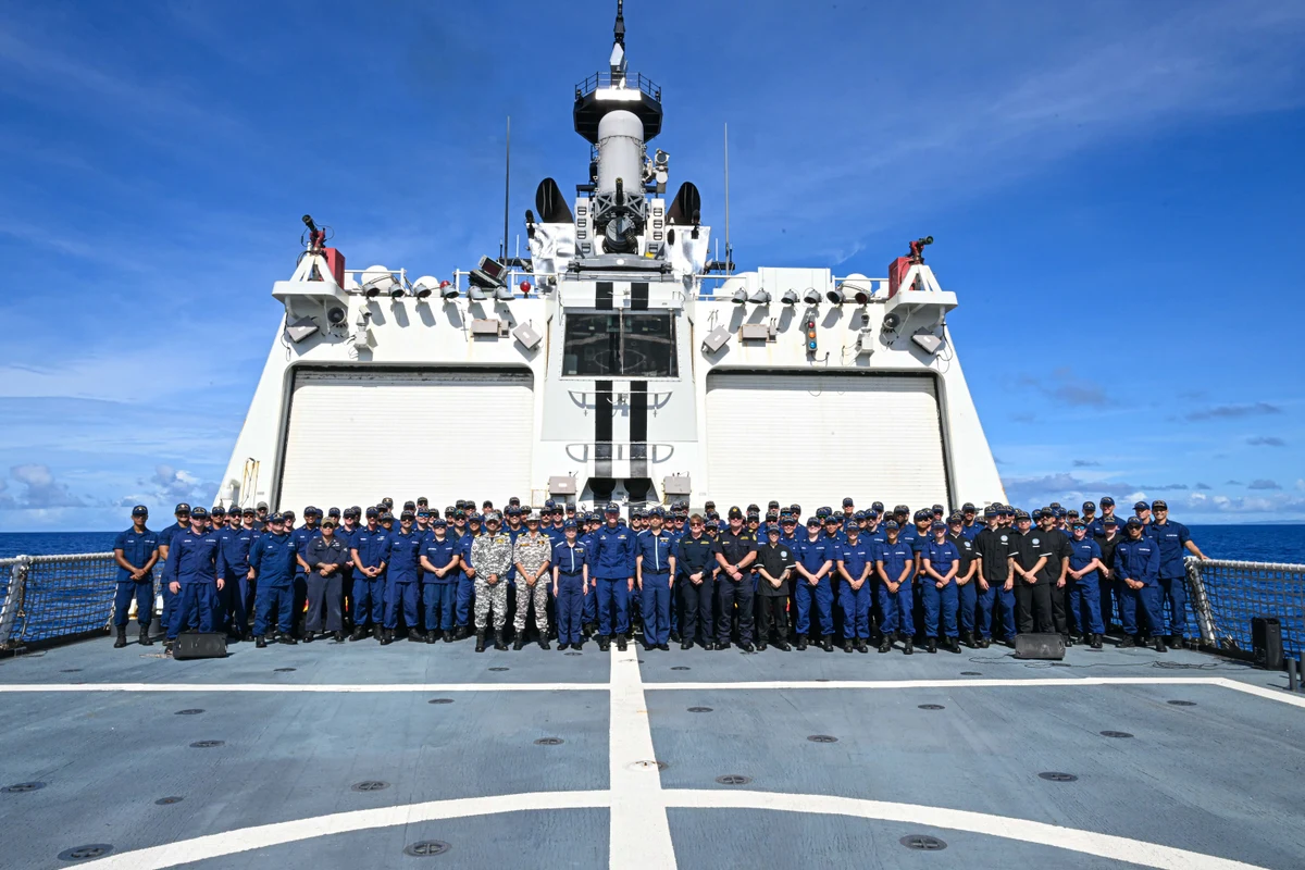 Quad officers and Stratton crew on the cutter’s flight deck on 1 July 2025