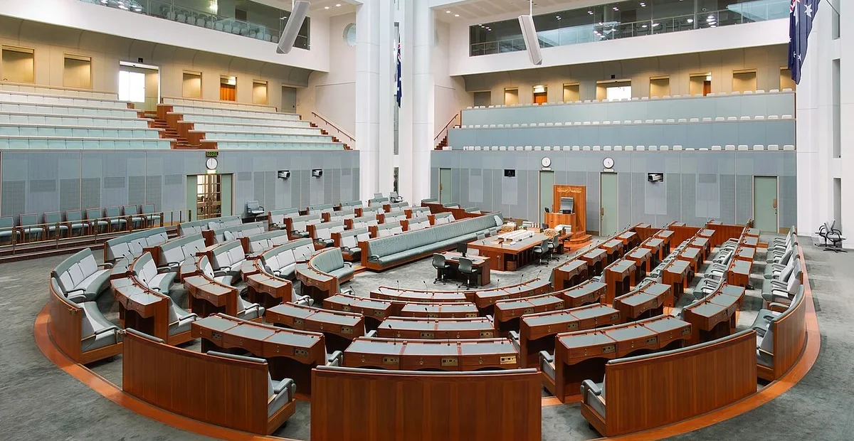 Australian House of Representatives chamber illustrating the migration poll policy debate