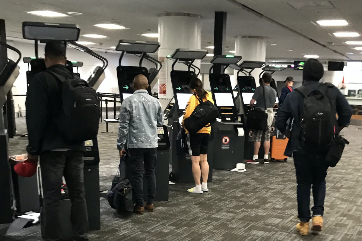 Travellers using border-clearance kiosks at Toronto Pearson in 2019